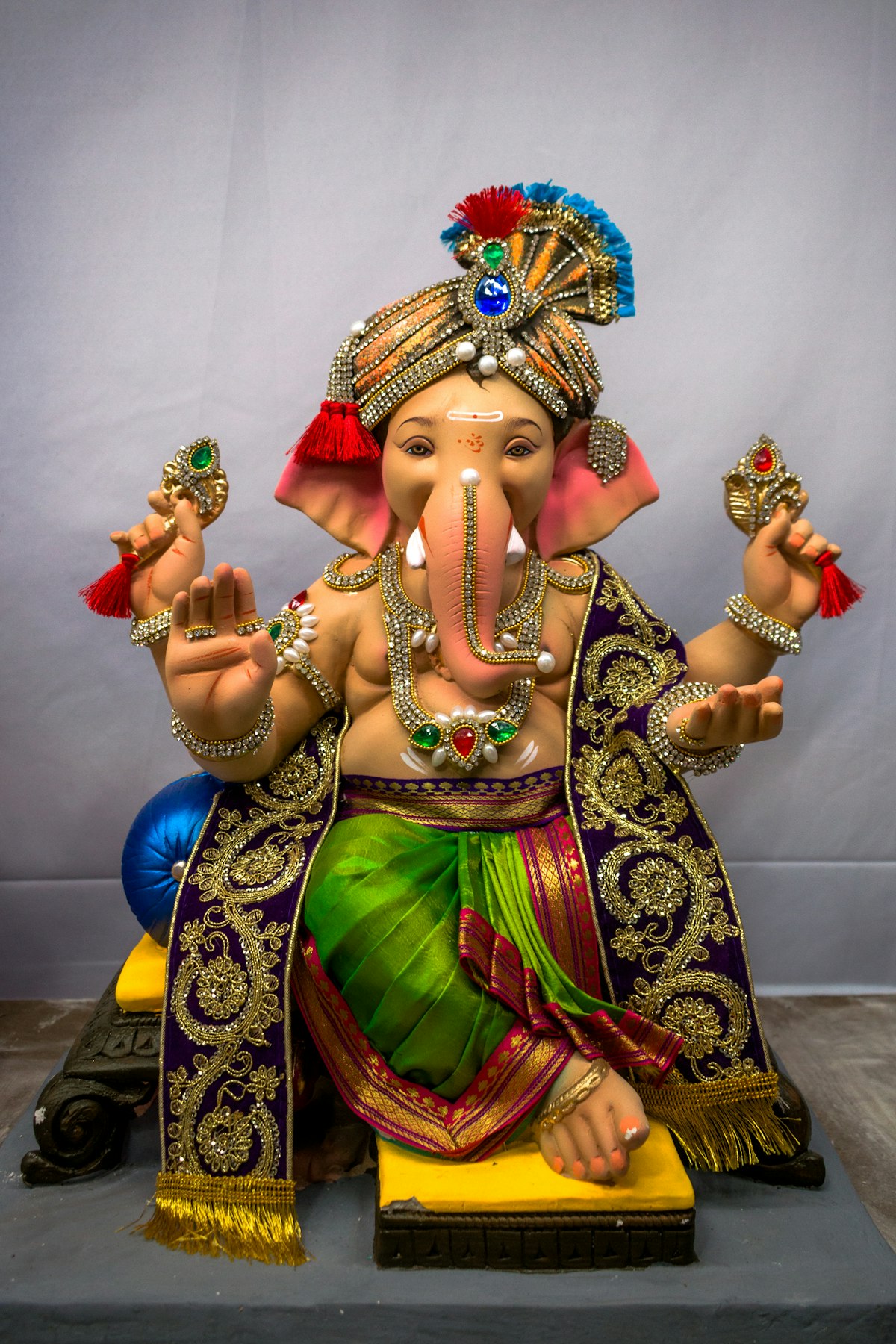 Ornate Ganesha idol wearing ceremonial garments — Mumbai style Ganesh Chaturthi 2026